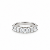 18ct white gold ring featuring nine emerald cut diamonds totalling 2.15ct in a straight row claw setting with a scalloped undercarriage.