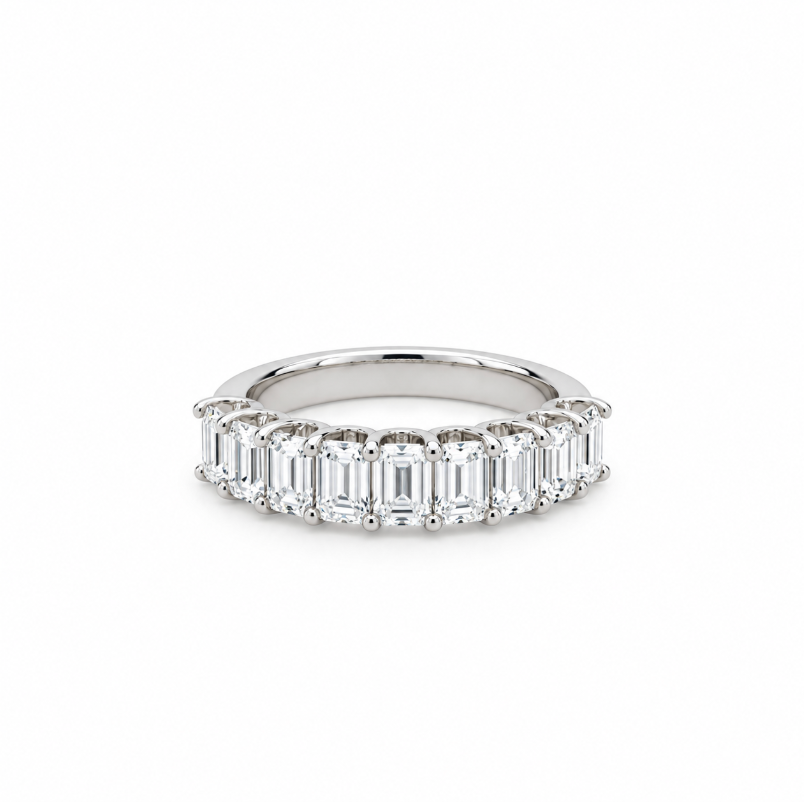 18ct white gold ring featuring nine emerald cut diamonds totalling 2.15ct in a straight row claw setting with a scalloped undercarriage.