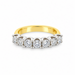 Seven-stone diamond ring in 18ct yellow and white gold featuring 1.38ct of round brilliant cut diamonds in shared-claw settings.