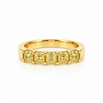 A yellow gold eternity ring featuring five asscher-cut yellow gemstones in a prong setting, displayed on a clean white background with a soft reflection.