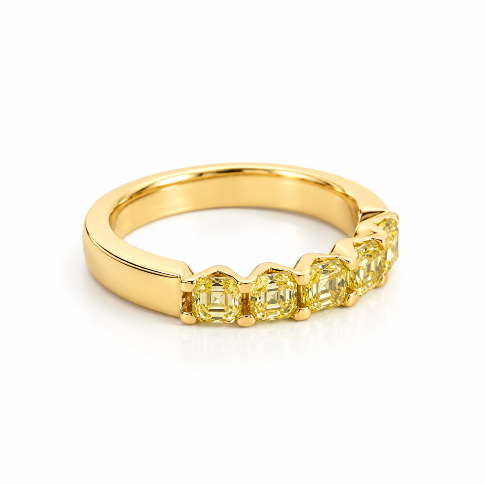 A yellow gold eternity ring featuring five asscher-cut yellow diamonds set in a polished band, shown on a clean white background.
