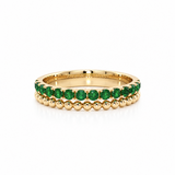 18ct yellow gold band ring with 14 round cut natural emeralds and beaded detailing