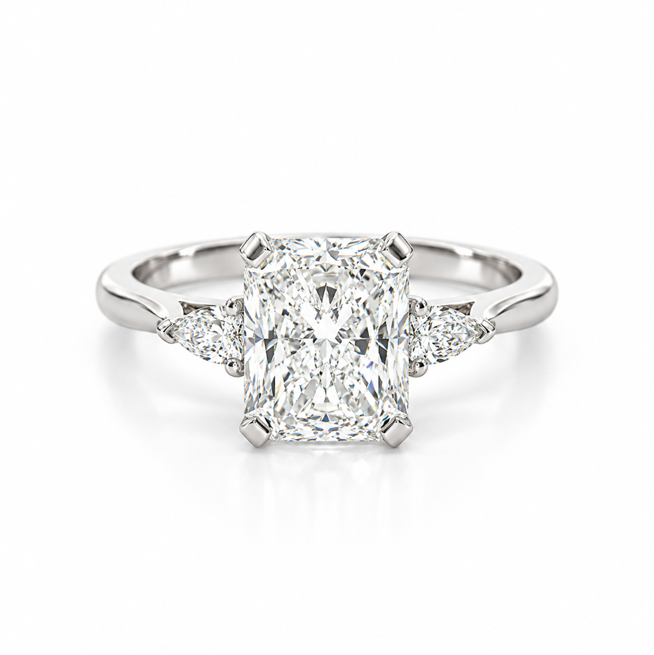 Platinum three-stone engagement ring featuring a 2.02ct radiant cut diamond with two pear cut diamond side stones.