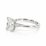 Platinum three-stone engagement ring featuring a 2.02ct radiant cut diamond with two pear cut diamond side stones.