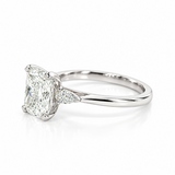 Platinum three-stone engagement ring featuring a 2.02ct radiant cut diamond with two pear cut diamond side stones.