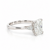 Platinum three-stone engagement ring featuring a 2.02ct radiant cut diamond with two pear cut diamond side stones.