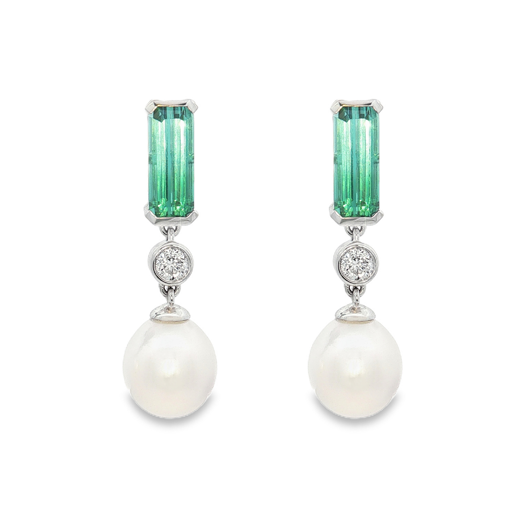 18ct white gold drop earrings featuring oval South Sea pearls, emerald cut ombré bi-colour tourmalines and bezel set natural round brilliant cut diamonds.