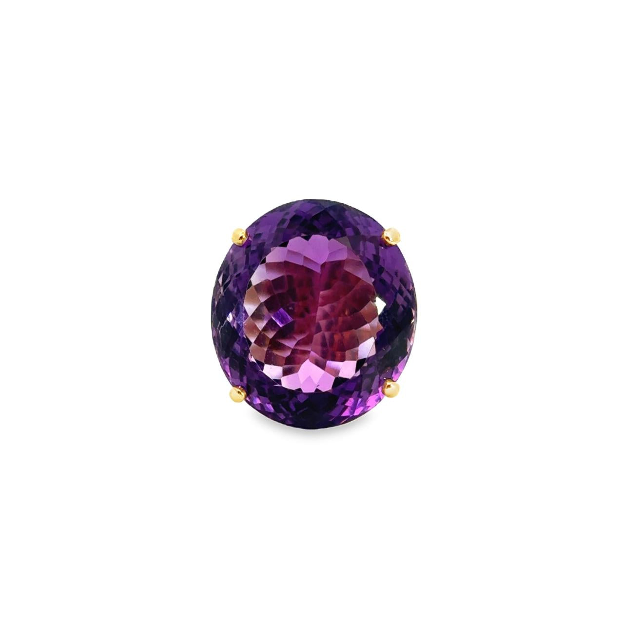 9ct yellow gold ring featuring a large 21.80 x 19.00mm fancy oval cut amethyst in a four-claw setting with engraved shoulder detailing.