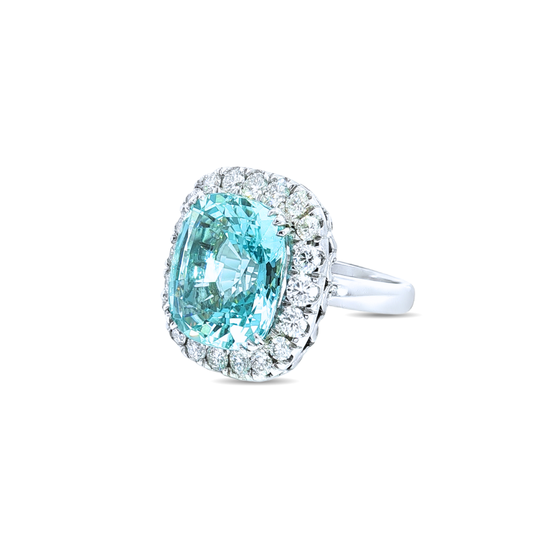 18ct white gold aquamarine and diamond ring featuring a 15.77ct cushion cut aquamarine surrounded by a cushion-shaped diamond halo.