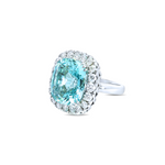 18ct white gold aquamarine and diamond ring featuring a 15.77ct cushion cut aquamarine surrounded by a cushion-shaped diamond halo.