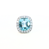 18ct white gold aquamarine and diamond ring featuring a 15.77ct cushion cut aquamarine surrounded by a cushion-shaped diamond halo.