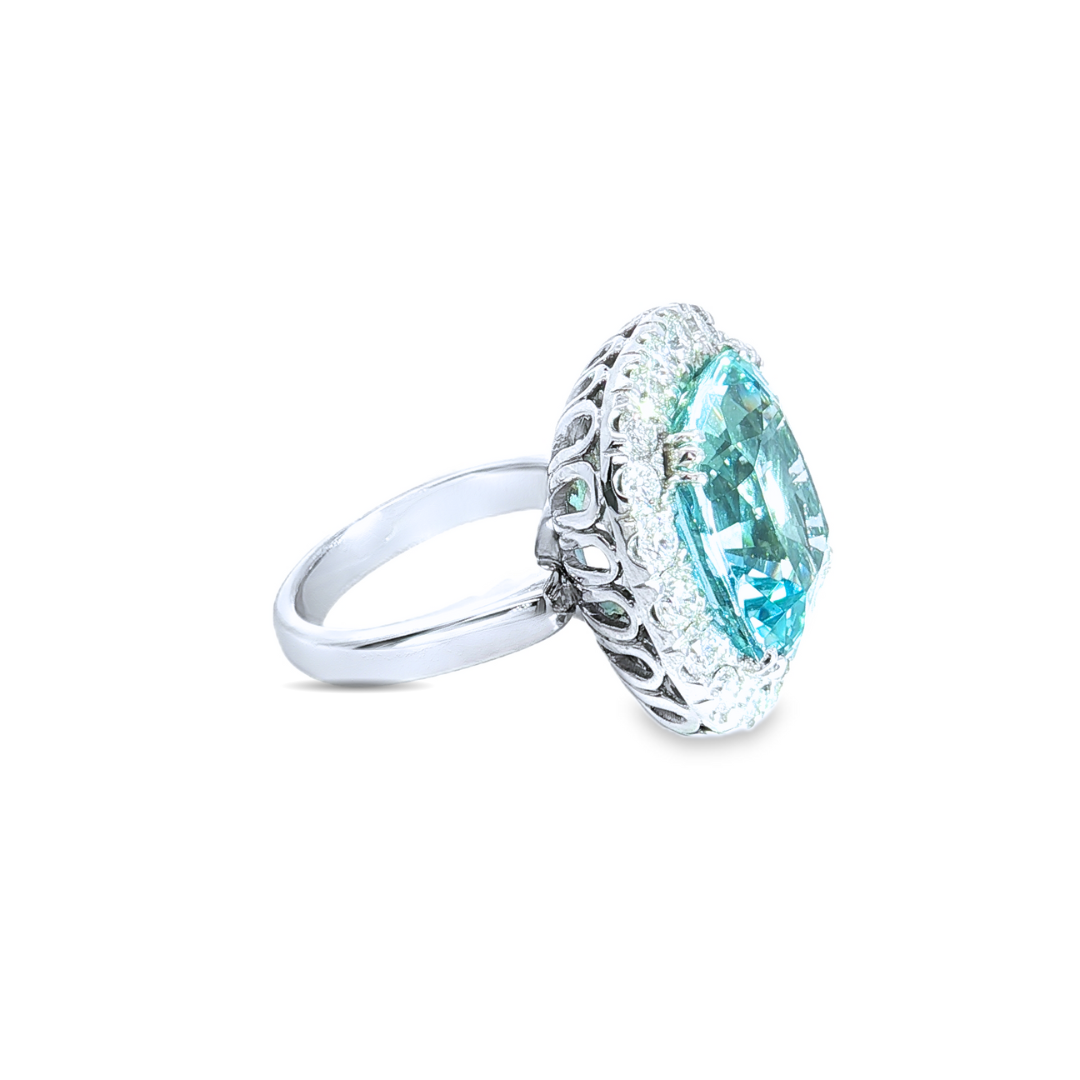 18ct white gold aquamarine and diamond ring featuring a 15.77ct cushion cut aquamarine surrounded by a cushion-shaped diamond halo.
