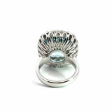 18ct white gold aquamarine and diamond ring featuring a 15.77ct cushion cut aquamarine surrounded by a cushion-shaped diamond halo.