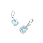 18ct white gold aquamarine and diamond drop earrings featuring cushion cut aquamarines with diamond halos and huggie-style fittings.
