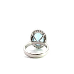 18ct white gold aquamarine and diamond halo ring featuring a 5.38ct oval aquamarine with 24 round brilliant cut diamonds, size N (resizeable).