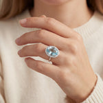 18ct white gold aquamarine and diamond halo ring featuring a 5.38ct oval aquamarine with 24 round brilliant cut diamonds, size N (resizeable).