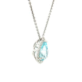 18ct white gold pendant featuring a 3.14ct pear-cut aquamarine in a three-claw setting with a graduated diamond halo surround and concealed pendant runner.