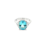 18ct white gold three-stone ring featuring a 3.44ct cushion cut aquamarine with two half moon cut diamond side stones.