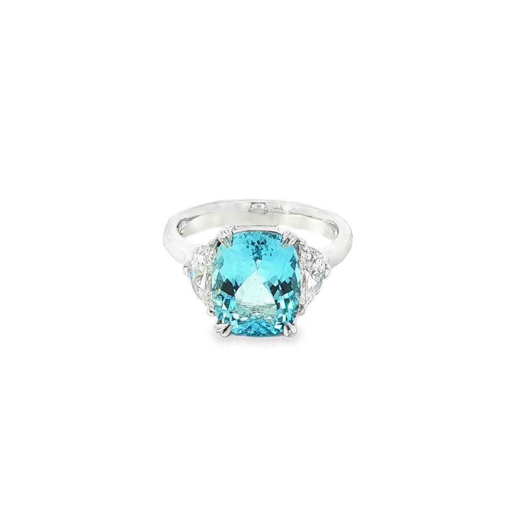 18ct white gold three-stone ring featuring a 3.44ct cushion cut aquamarine with two half moon cut diamond side stones.