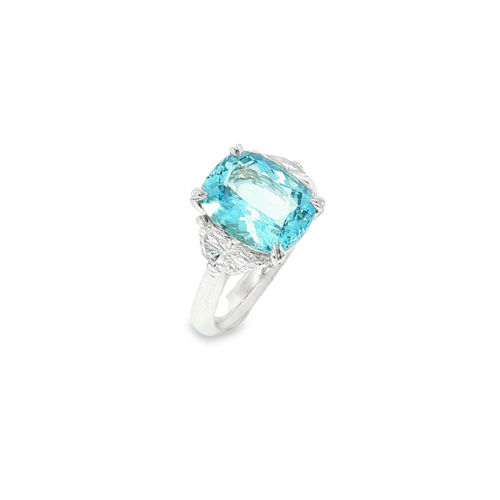 18ct white gold three-stone ring featuring a 3.44ct cushion cut aquamarine with two half moon cut diamond side stones.