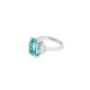 18ct white gold three-stone ring featuring a 3.44ct cushion cut aquamarine with two half moon cut diamond side stones.