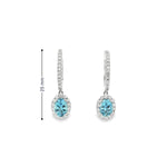 18ct white gold aquamarine and diamond drop earrings with oval blue gemstones and diamond halo