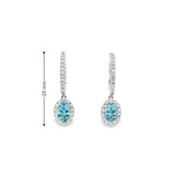 18ct white gold aquamarine and diamond drop earrings with oval blue gemstones and diamond halo