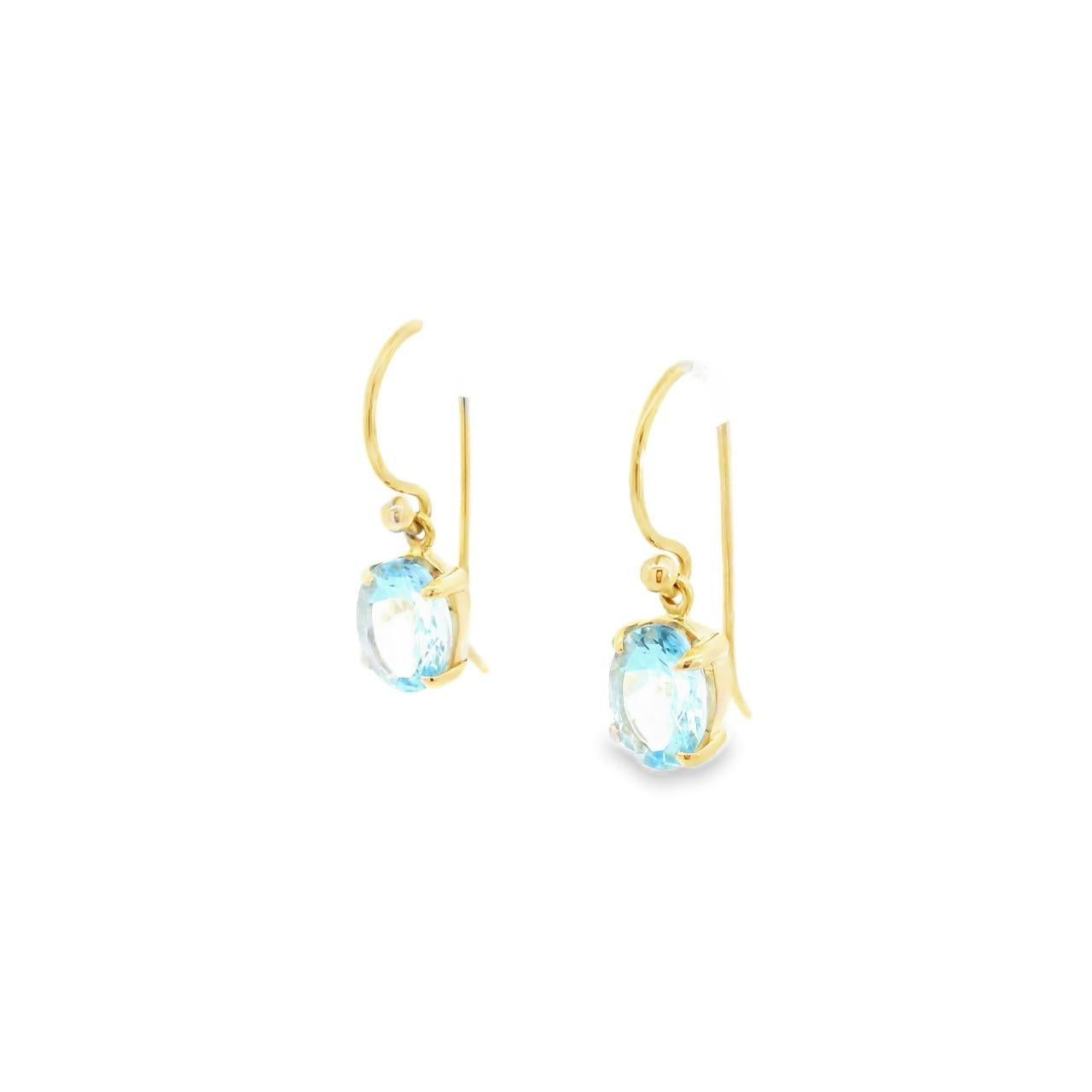 9ct yellow gold drop earrings featuring 8x6mm oval-cut aquamarines in four-claw settings with hook fittings.