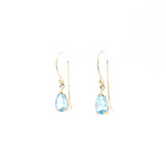 9ct yellow gold drop earrings featuring 8x5mm pear-cut aquamarines in v-cap and claw settings with hook fittings.