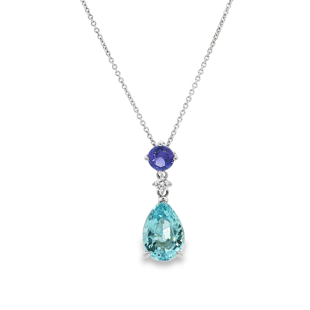 18ct white gold pendant featuring a pear-cut aquamarine, round-cut tanzanite and diamond in articulated claw-set design for elegant movement and brilliance.