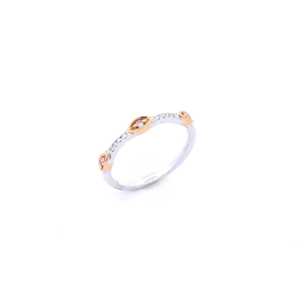 Two-tone white and rose gold ring featuring Argyle pink diamonds in marquise-shaped bead settings with white diamond claw accents.