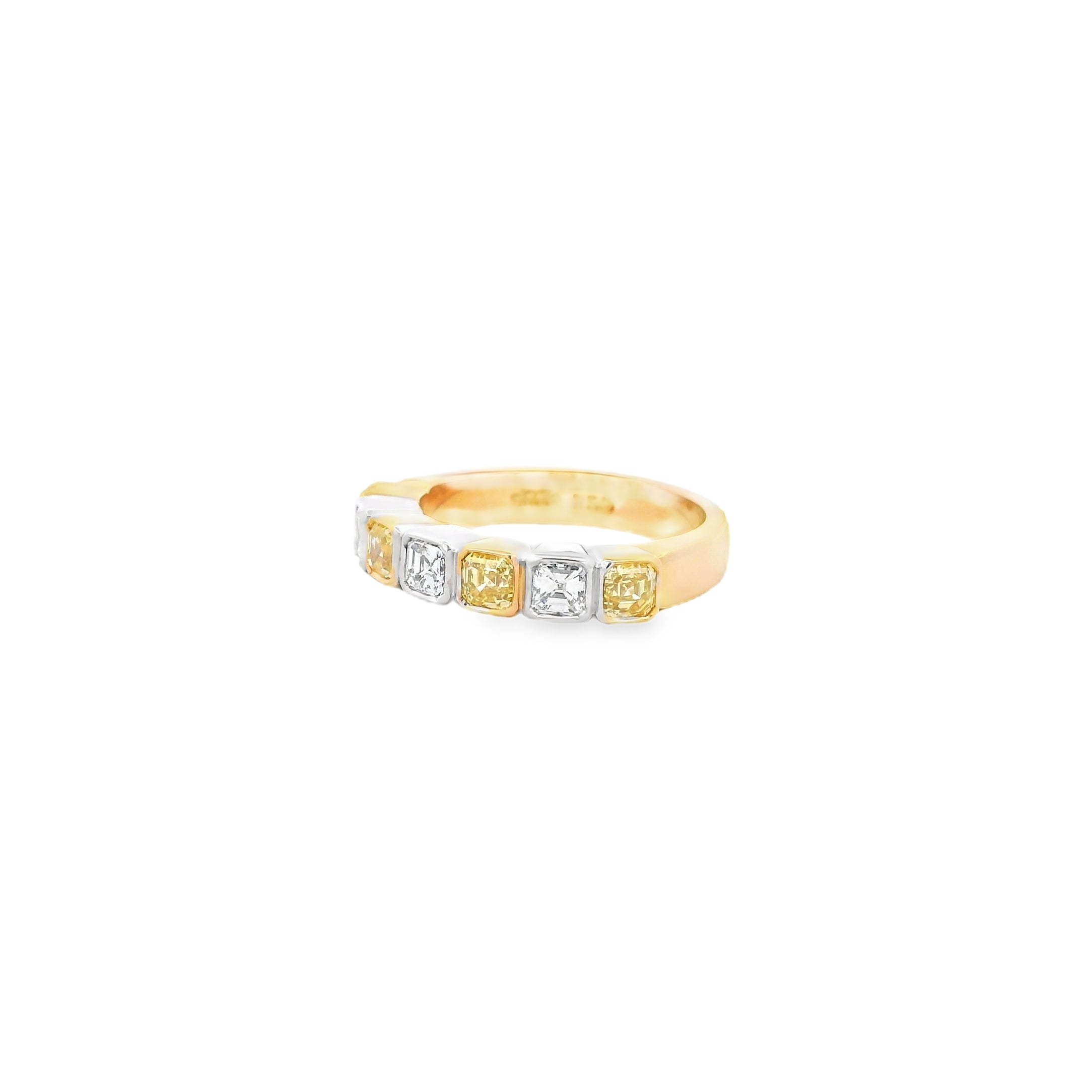 18ct yellow and white gold ring featuring alternating asscher cut yellow and white diamonds set in a straight row of bezel settings.