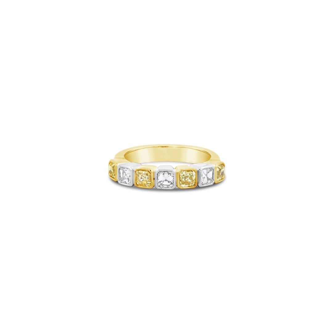 18ct yellow and white gold ring featuring alternating asscher cut yellow and white diamonds set in a straight row of bezel settings.