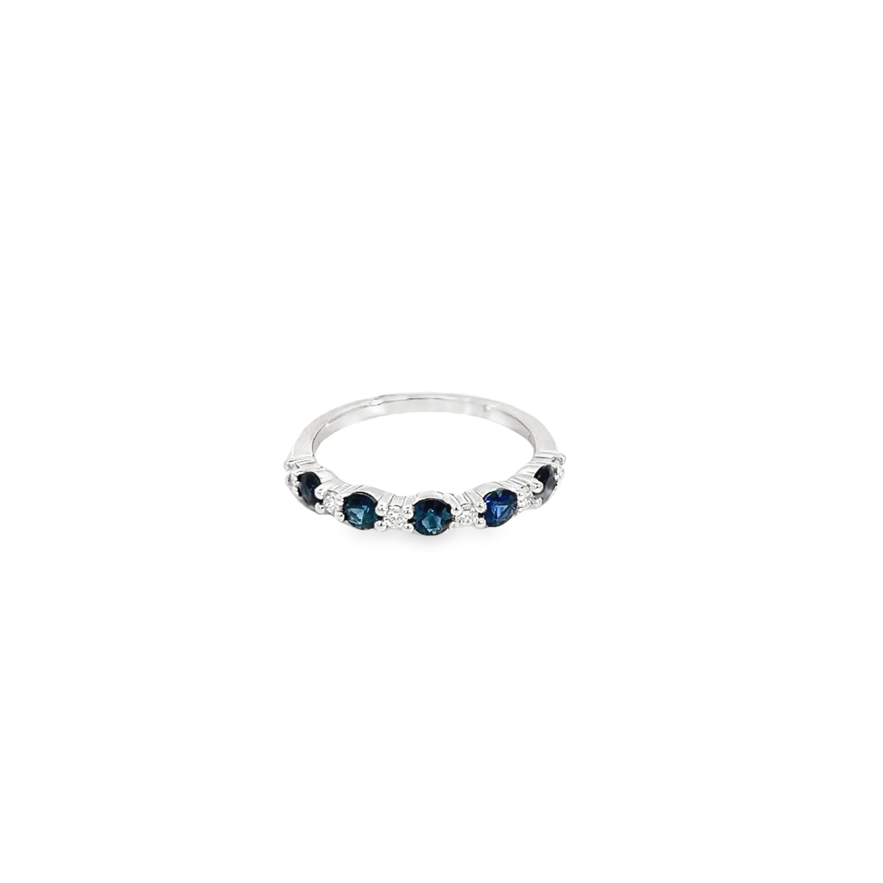 18ct white gold ring featuring alternating claw-set Australian blue sapphires and diamonds across the top with post and bezel undercarriage.