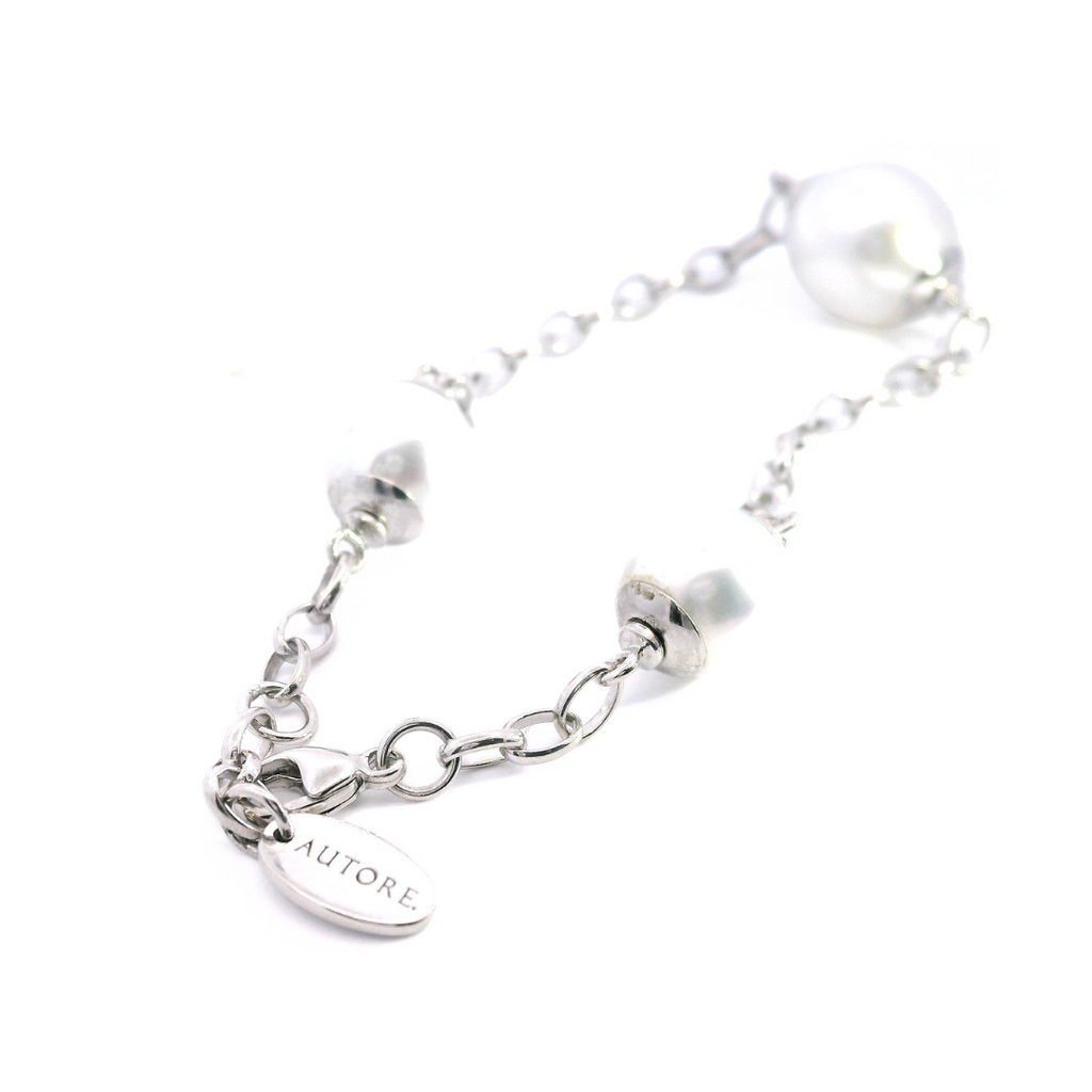 Autore sterling silver bracelet featuring one 12mm and two 9mm semi-drop silver South Sea pearls set along an oval belcher link chain.