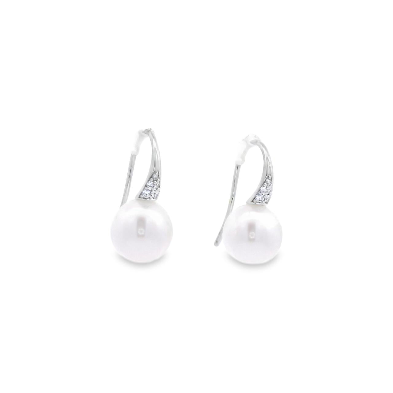 Autore white gold hook earrings with diamond cluster tops and 9mm South Sea pearl drops.