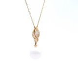 Autore yellow gold twist pendant with South Sea pearl and bead-set diamonds on fine trace link chain.