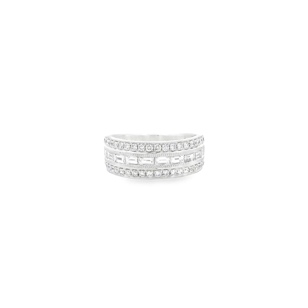 18ct white gold ring featuring a centre row of baguette cut diamonds with outer rows of round brilliant cut diamonds, bead set with millgrain edges.