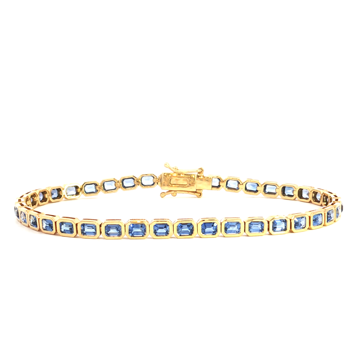 18ct yellow gold blue sapphire bracelet featuring articulated octagonal links with bezel-set emerald cut sapphires.