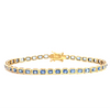 18ct yellow gold blue sapphire bracelet featuring articulated octagonal links with bezel-set emerald cut sapphires.