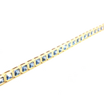 18ct yellow gold blue sapphire bracelet featuring articulated octagonal links with bezel-set emerald cut sapphires.