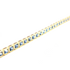 18ct yellow gold blue sapphire bracelet featuring articulated octagonal links with bezel-set emerald cut sapphires.