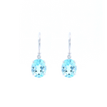 9ct white gold drop earrings featuring 10x8mm oval-cut blue topaz gemstones in four-claw settings with hook fittings.