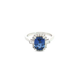 18ct white gold ring featuring a 2.21ct Ceylon sapphire flanked by tapered baguette and round brilliant cut diamonds totalling 0.50ct.