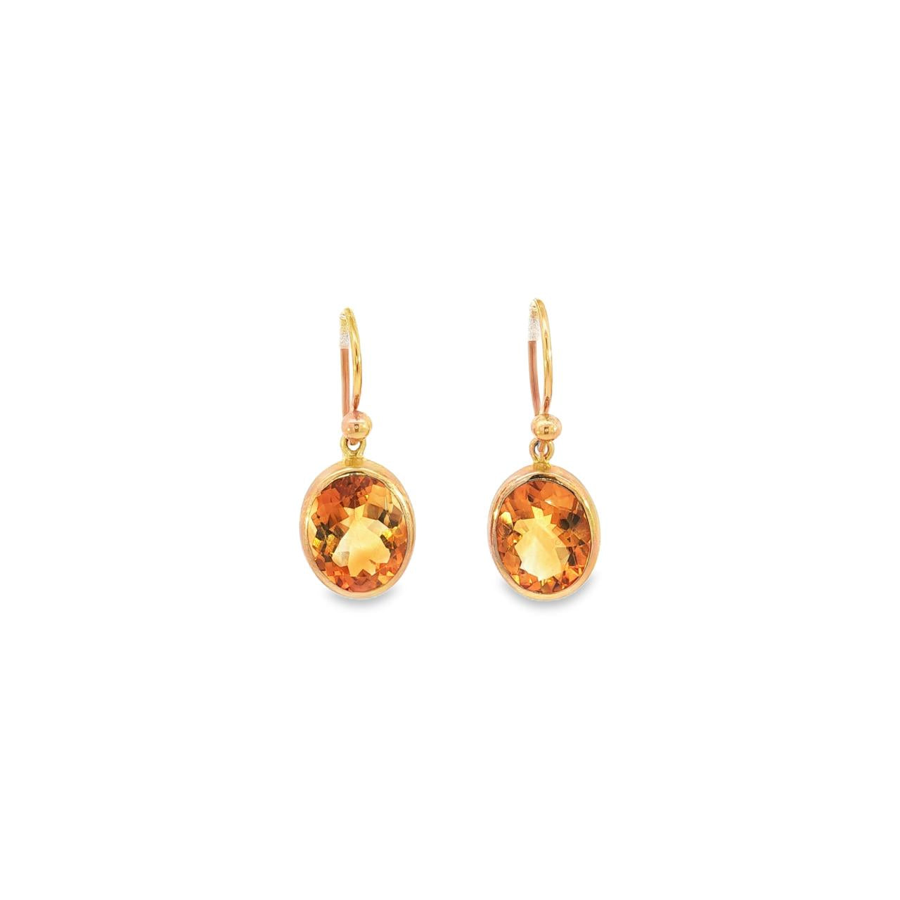 9ct yellow gold oval citrine stud earrings with bezel settings.