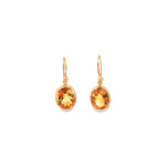 9ct yellow gold oval citrine stud earrings with bezel settings.