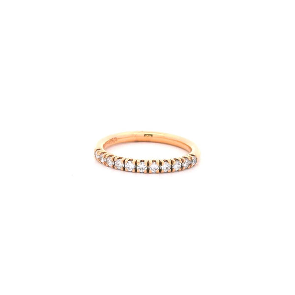 18ct rose gold diamond ring featuring a straight row of claw-set round brilliant cut diamonds across the top.