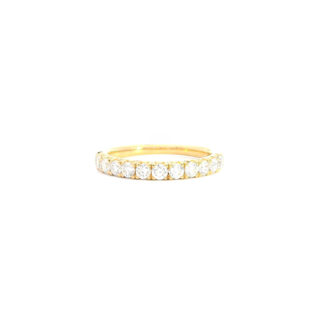 18ct yellow gold diamond ring featuring twelve round brilliant cut diamonds in a straight row claw setting across the top.