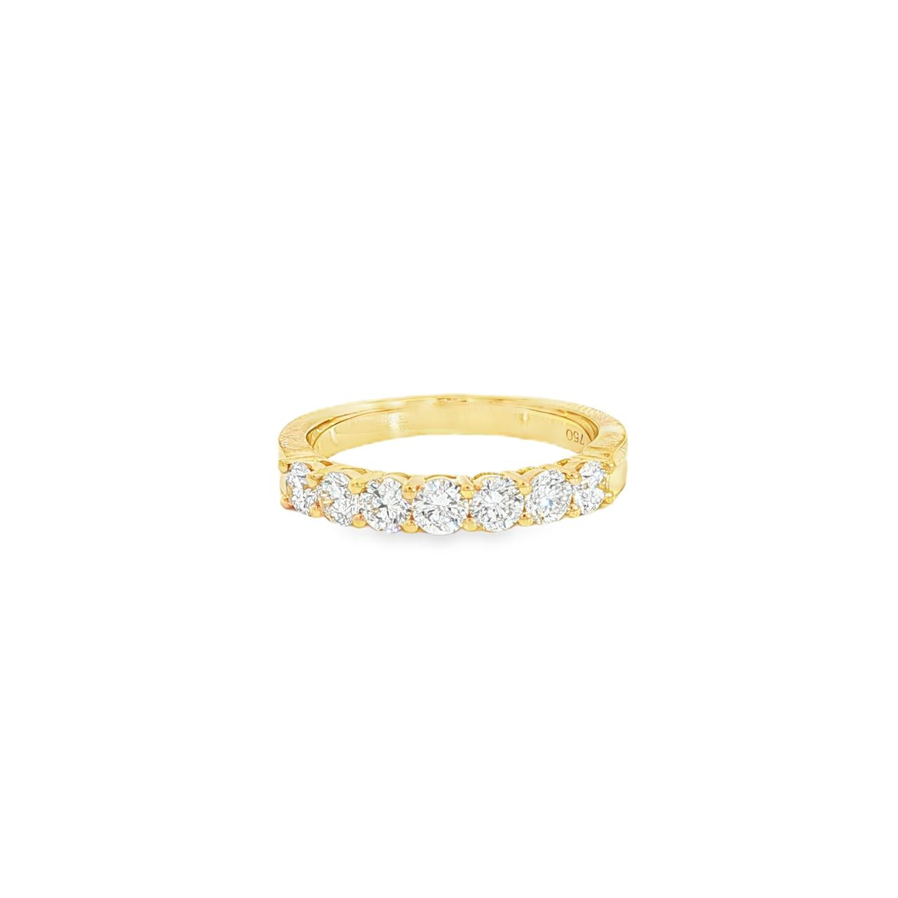 18ct yellow gold diamond ring featuring seven round brilliant cut diamonds in a straight row claw setting across the top.