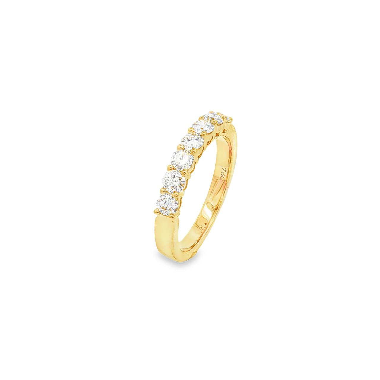 18ct yellow gold diamond ring featuring seven round brilliant cut diamonds in a straight row claw setting across the top.